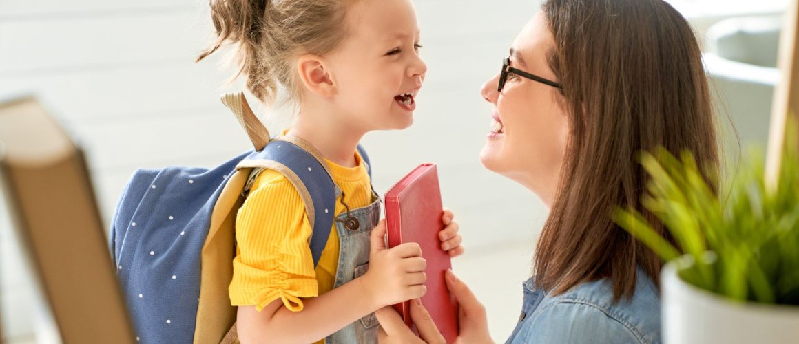 Mom and daughter going to first day of school