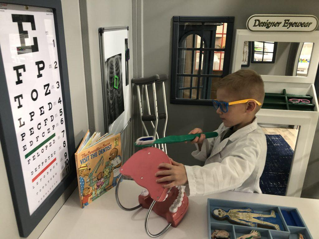 kid playing dentist
